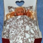Doll's cardboard box bed