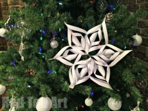 How to make paper snowflakes - we love 6 pointed snowflakes as they are that little bit more special. Here we show step by step instructions of how to cut a snowflake from paper. #Snowflake #papercrafts #papersnowflakes #winter #christmas #winterdecor #papercraftskids