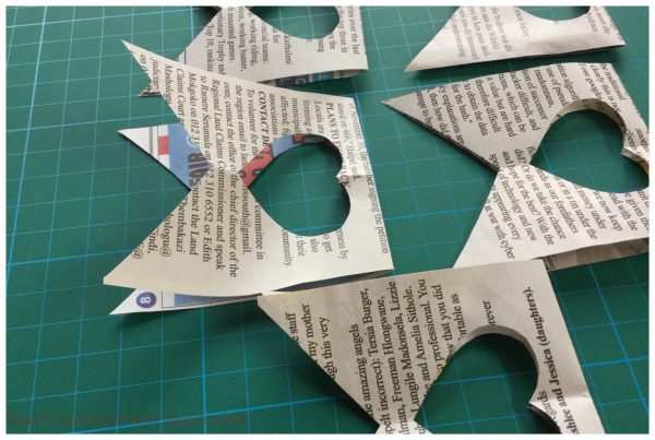 Newspaper Heart Garland - a great way to upcycle newspapers and create some lovely room decor. Make this newspaper DIY for valentine's day or just because!