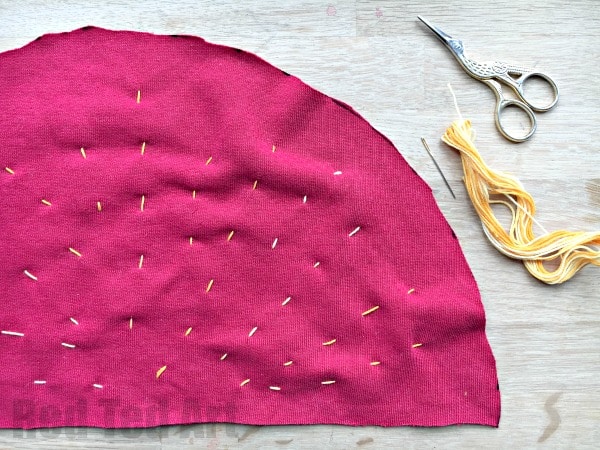 How to sew a Strawberry Plushie. Easy sewing project for kids. Love that this is made from a repurposed red sweater!. How to sew a running stitch - strawberry seeds