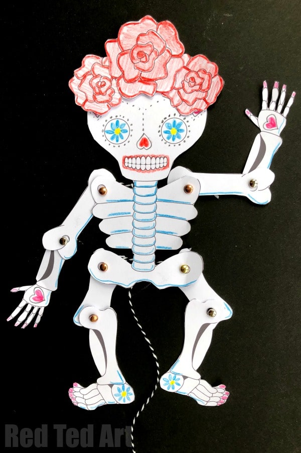Day of the Dead Crafts and Activities for Kids featured by top Seattle lifestyle blogger, Marcie in Mommyland: Day of the Dead Paper Puppet Template - if you love Sugar Skull DIYs, check out this great Skeleton Paper Puppet - leave it plain for Halloween or customise it as you wish for Day of the Dead. It is a great way to get arty, with the help of a super simple paper puppet template!
