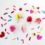 A cute Valentine's Gift for Kids to make - easy Heart Pom Pom Pin! An easy Kids' Valentine's Day Craft to keep or give to a loved one. #valentines #pompoms #hearts #gifts