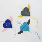 A cute Valentine's Gift for Kids to make - easy Heart Pom Pom Pin! An easy Kids' Valentine's Day Craft to keep or give to a loved one. #valentines #pompoms #hearts #gifts
