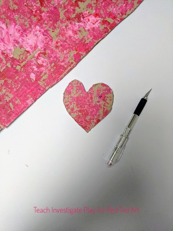 Process Art Valentine's Wall Hanging. Process Art Valentine's Wall Hanging - a wonderful process art project for Valentine's. Let the kids go wil dwith their creativity, explore print making and colour mixing and make these gorgeous heart wall hangings for Valentines! #valentines #valentinesday #processart #artforkids #kidscraft
