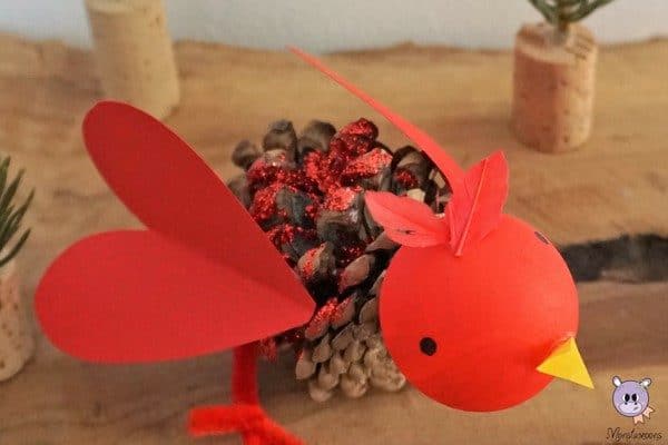 Pine Cone Bird Ornament. Make these adorable Pine Cone LOVE birds for Valentine's Day or as a gorgeous Cardinal Christmas Ornament. #pinecones #nature #naturecrafts #valentines #valentinesday #christmasornaments