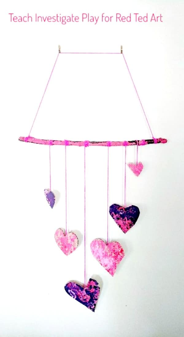Process Art Valentine's Wall Hanging - a wonderful process art project for Valentine's. Let the kids go wil dwith their creativity, explore print making and colour mixing and make these gorgeous heart wall hangings for Valentines! #valentines #valentinesday #processart #artforkids #kidscraft