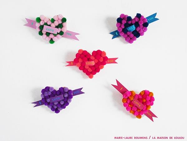A cute Valentine's Gift for Kids to make - easy Heart Pom Pom Pin! An easy Kids' Valentine's Day Craft to keep or give to a loved one. #valentines #pompoms #hearts #gifts