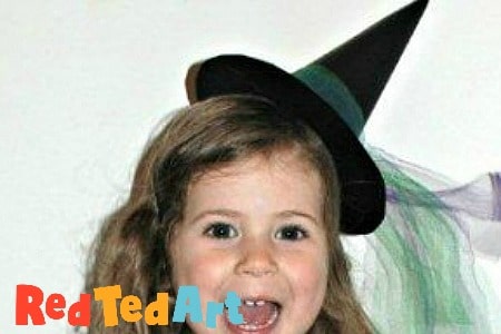 Girl wearing paper witch hat fascinator