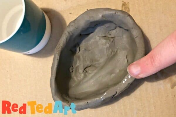 Smoothing your pinch pot down with water