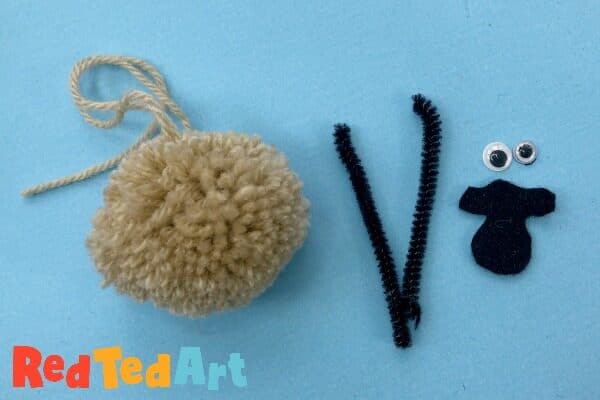 Turning a pom pom into a sheep