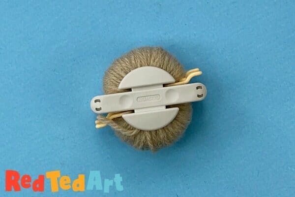 Making pom pom sheep