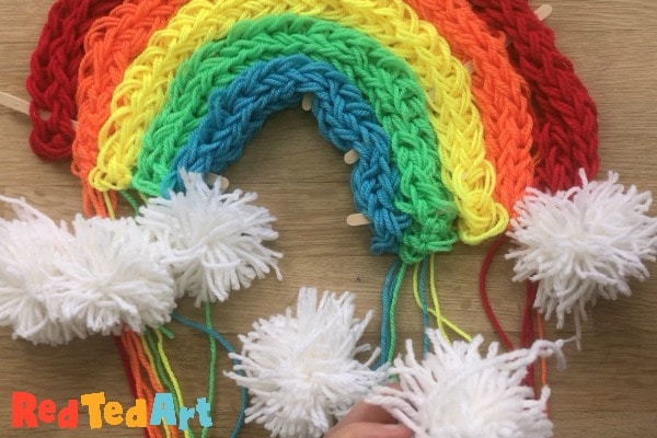 secure the pompoms to the rainbow