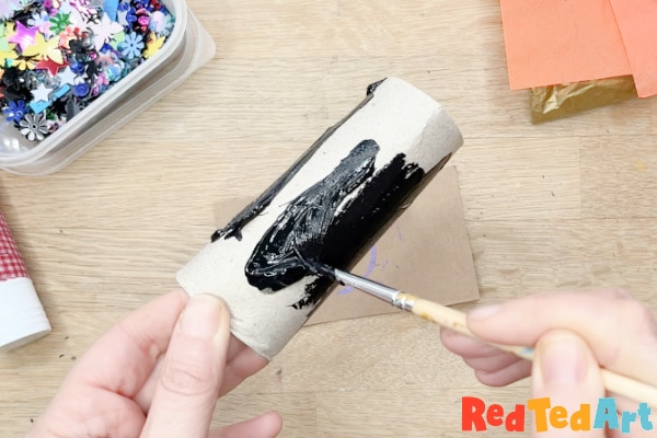 paint the paper roll black as the night's sky