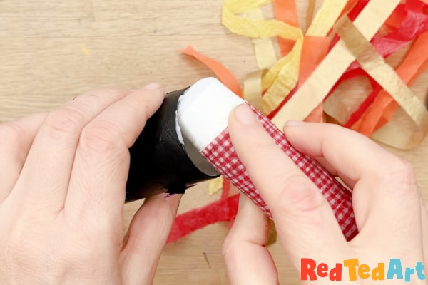 add glue stick to your toilet paper roll blower