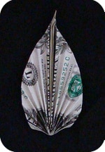 a paper leaf made from a dollar bill