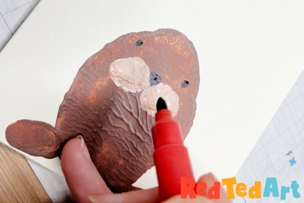 add a walrus face with markers
