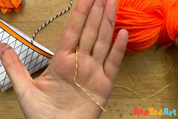 place yarn between index and middle finger